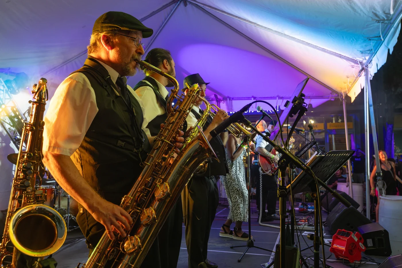 Saxophone section under festival tent
